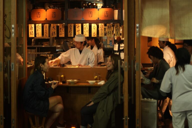 Japanese Restaurant Etiquette: How To Behave in a Japanese Restaurant Two women dining in a Japanese restaurant with correct Japanese restaurant etiquette