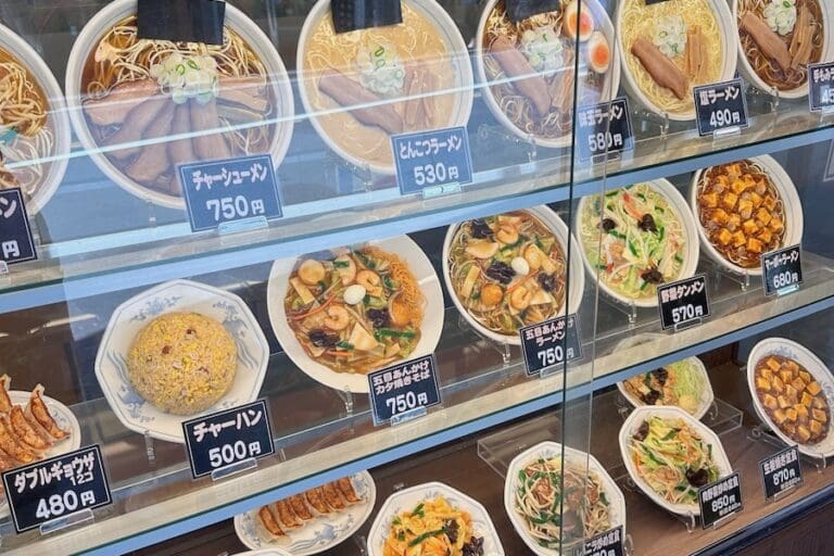 Must-Eat Foods In Japan: The Ultimate Checklist For Completionists Plastic food items in the window of a Japanese restaurant