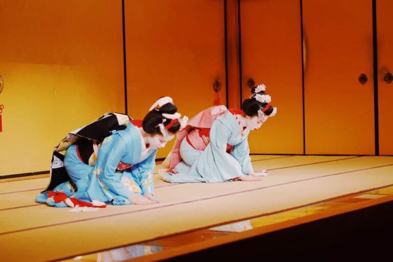 Where to See Geisha in Kyoto: Best Shows and Real Experiences Two maiko bowing on stage during a traditional dance performance in Kyoto