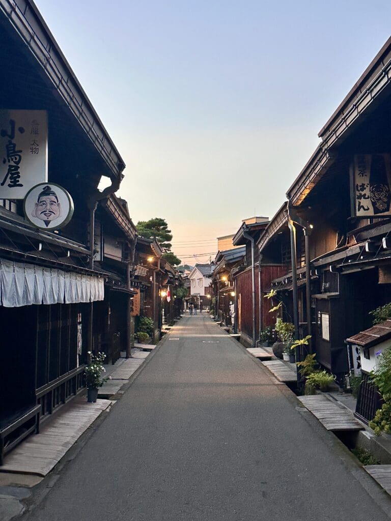 Narrow street in Takayama’s Kami Sannomachi lined with traditional wooden buildings