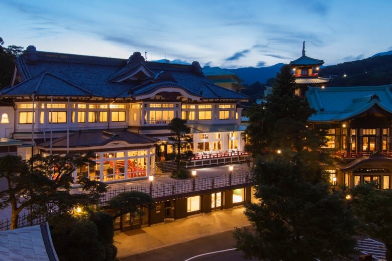 Hakone Fujiya Hotel at dusk with illuminated traditional buildings