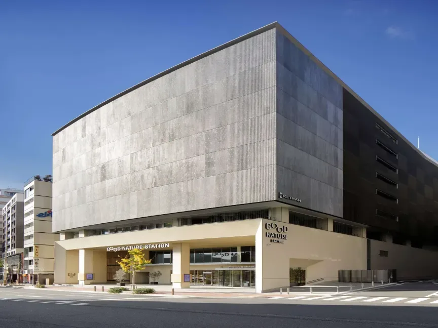 Good Nature Station building in Kyoto with a modern gray facade and street-level entrance