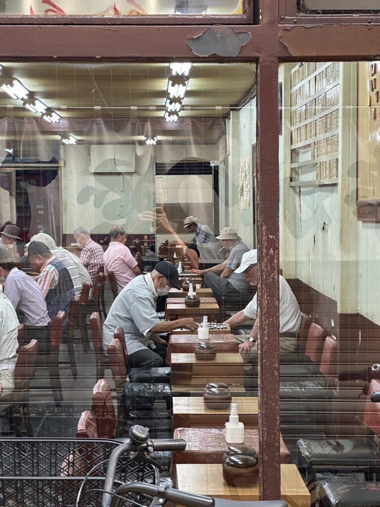 Elderly men playing go at an igo parlor in Osaka