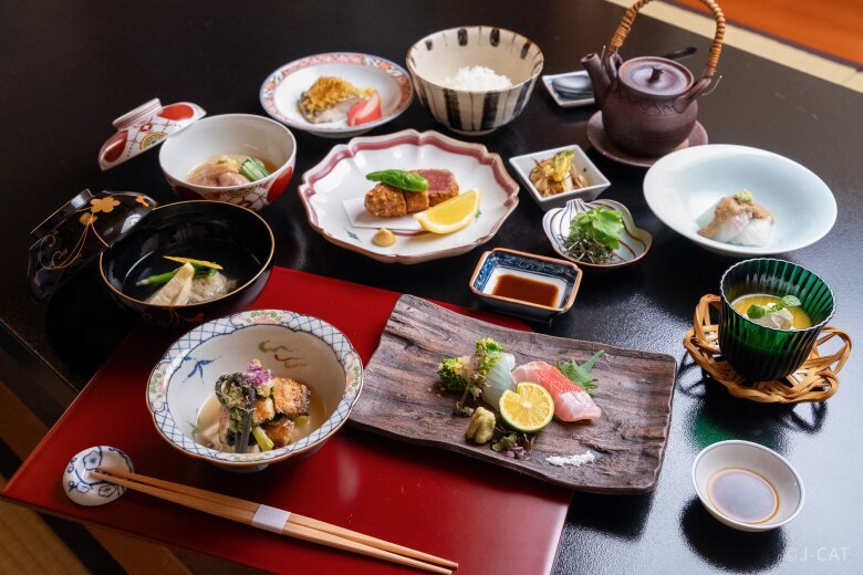 Traditional kaiseki dinner with assorted Japanese dishes on a table